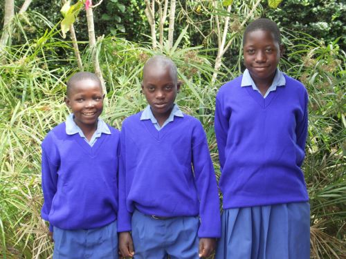 Children in donated sweaters